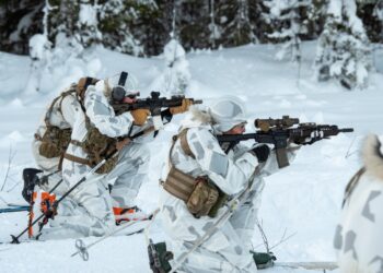 Airmen with the Kentucky Air National Guard’s 123rd Special Tactics Squadron fire their M4 rifles while on skis at a range in Grubbnäsudden, Sweden, Jan. 13, 2022. Fifteen members from the 123rd STS
