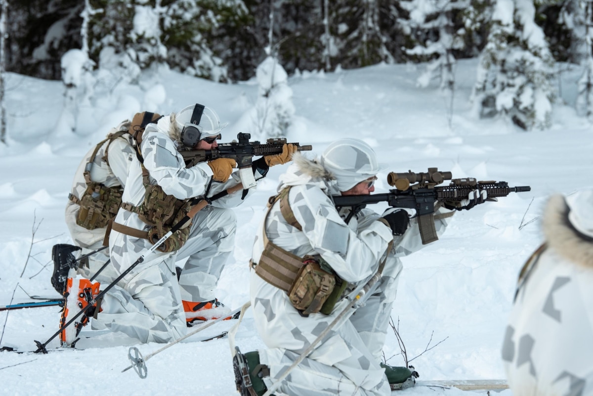 Airmen with the Kentucky Air National Guard’s 123rd Special Tactics Squadron fire their M4 rifles while on skis at a range in Grubbnäsudden, Sweden, Jan. 13, 2022. Fifteen members from the 123rd STS