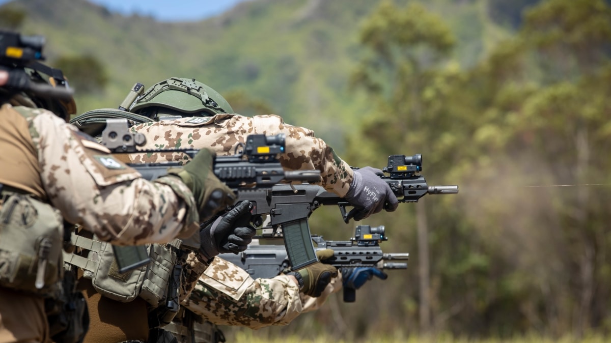 220629-M-GI936-1220 WAHIAWA, Hawaii (June 29, 2022) - Personnel with the German Maritime Interdiction Operations Company conduct lateral drills during live-fire training during Rim of the Pacific