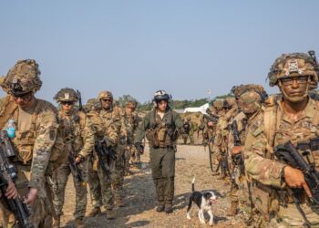 U.S. Army Soldiers with Charlie Company, 1st Battalion, 27th Infantry Regiment, 2d Brigade Combat Team, 25th Infantry Division, board a U.S. Marine Corps CH-53e Super Stallion at Fort Magsaysay Airfield in preparation for air assault training during Balikatan 23 in Paredes