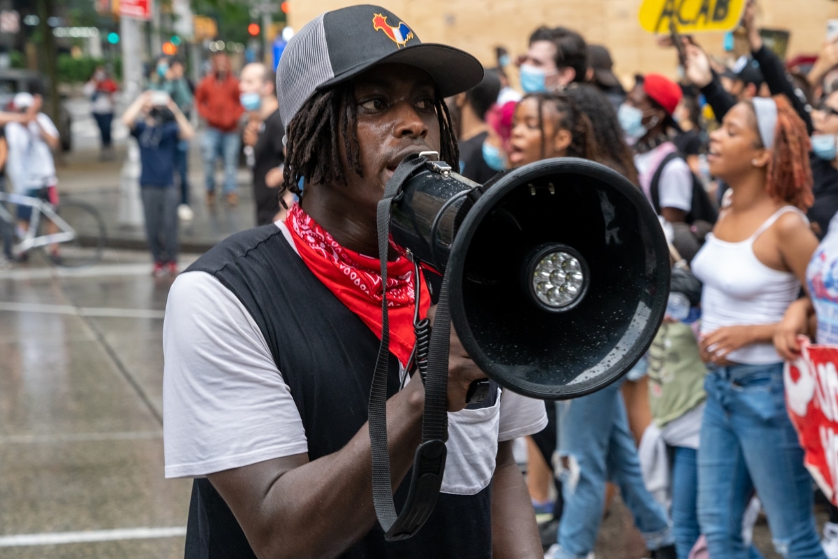 NEW YORK, NY - JUNE 05: A man shouting slogans over a megaphone as demonstrations continue in Manhattan over the killing of George Floyd by a Minneapolis Police officer on June 05, 2020 in NY City.