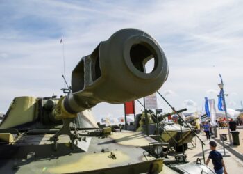 Moscow, Russia - August 25, 2020: International Military-Technical Forum "Army-2020", Tank cannon in the foreground against the background of an exhibition of heavy artillery.