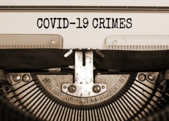 Text 'Covid19 crimes' typed on retro typewriter. Business and post-pandemic covid-19 concept.