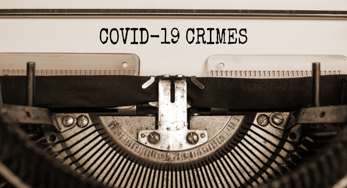 Text 'Covid19 crimes' typed on retro typewriter. Business and post-pandemic covid-19 concept.