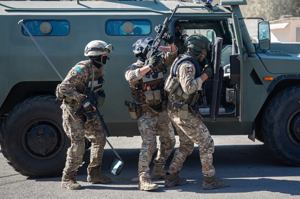 Kazakhstan, Almaty, January 8, 2022. Special Forces on a mission. Military peacekeepers with machine guns repulse the attack of the invaders, hold the defense, capture the terrorists.