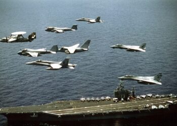 Aircraft assigned to the nuclear-powered aircraft carrier USS GEORGE WASHINGTON fly over the ship. Oct. 25 1992.