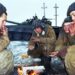GUDERMES, CHECHNYA - JAN 16: Russian army armor troops try to keep warm, and catch a few minutes rest between fighting Chechen rebels in Gudermes, Chechnya, on Sunday, January 16, 2000.