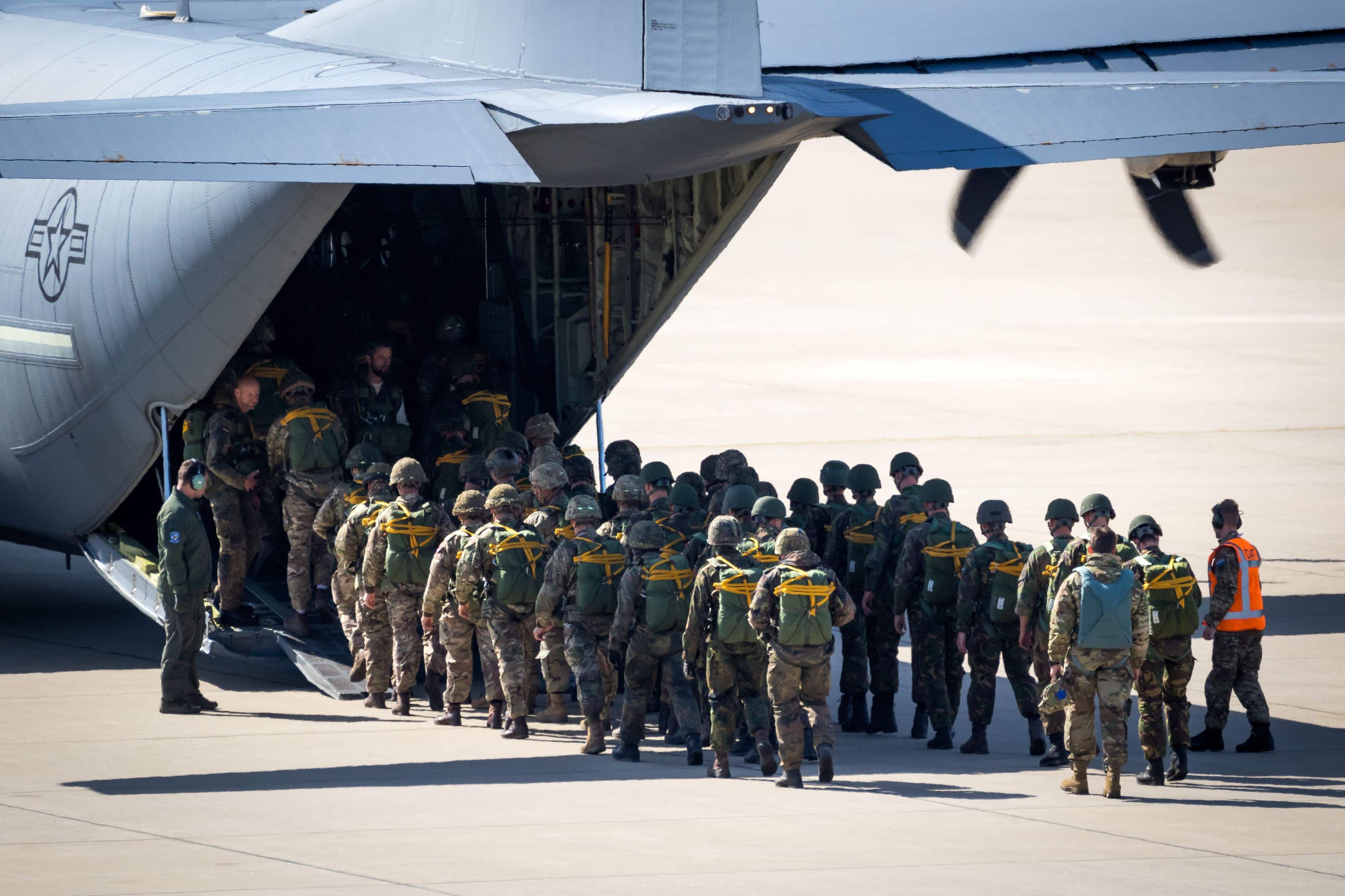 Paratroopers entering a US Air Force C-130 Hercules transport plane on Eindhoven airbase. The Netherlands - September 20, 2019