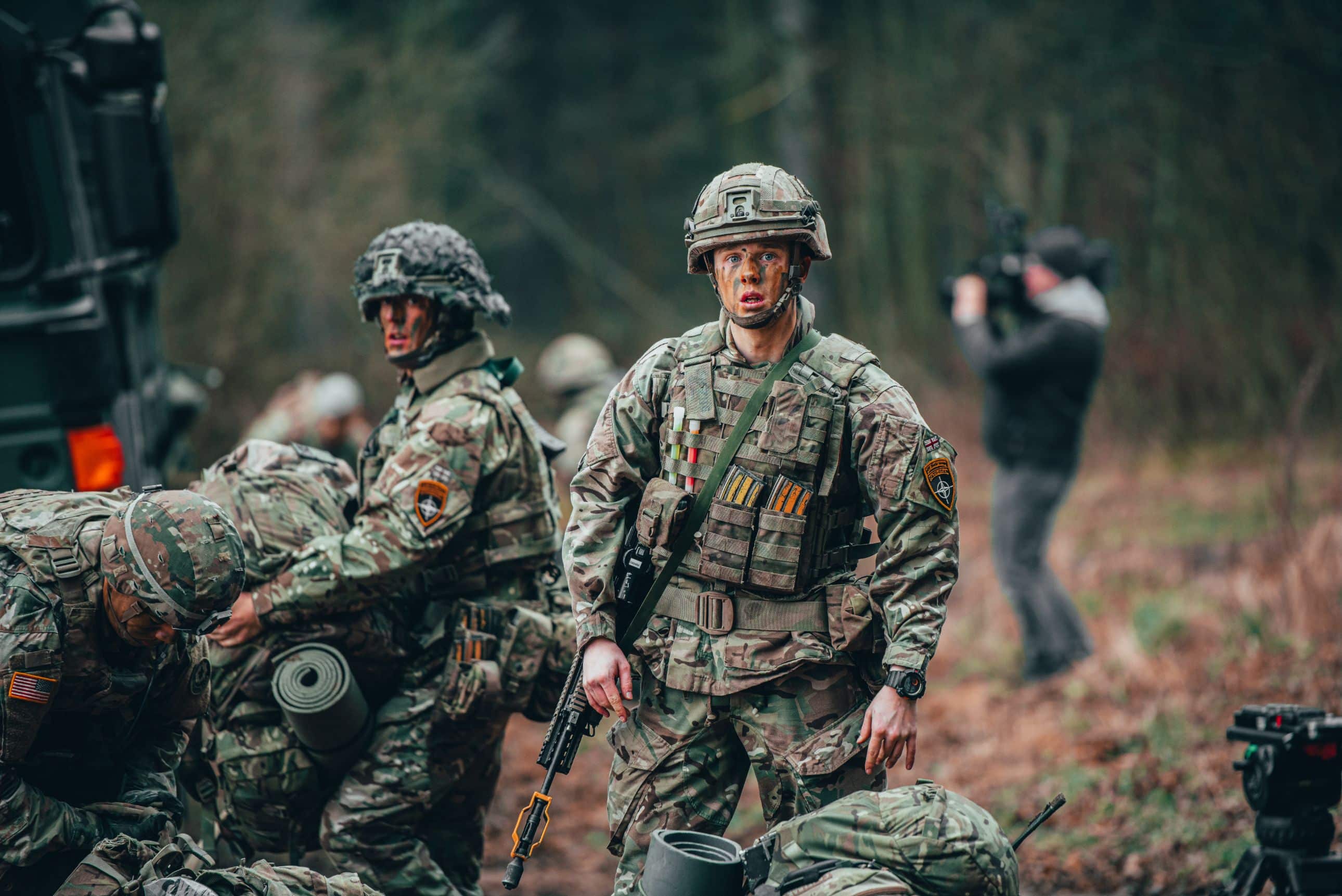 A British Soldier, assigned to the Balaklava Troop, C Squadron, also known as the Royal Scots Dragoon Guards, pauses and looks at the camera before conducting a patrolling class during a course designed to instill the fundamentals of leadership at the tactical level in Bemowo Piskie, Poland
