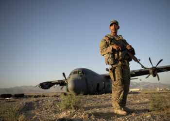 Airman 1st Class Christian Mejia, 376th Expeditionary Security Forces Squadron Fly Away Security Team member, Transit Center at Manas, Kyrgyzstan, is responsible for guarding a disabled C-130 Hercules aircraft at Forward Operating Base Shank, Logar province, Afghanistan