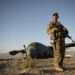 Airman 1st Class Christian Mejia, 376th Expeditionary Security Forces Squadron Fly Away Security Team member, Transit Center at Manas, Kyrgyzstan, is responsible for guarding a disabled C-130 Hercules aircraft at Forward Operating Base Shank, Logar province, Afghanistan