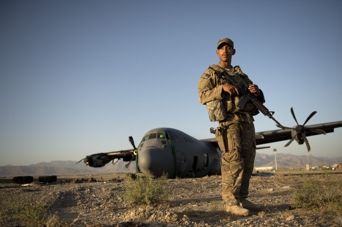 Airman 1st Class Christian Mejia, 376th Expeditionary Security Forces Squadron Fly Away Security Team member, Transit Center at Manas, Kyrgyzstan, is responsible for guarding a disabled C-130 Hercules aircraft at Forward Operating Base Shank, Logar province, Afghanistan