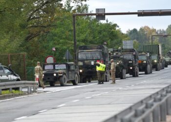 Polish military police escort a group of Soldiers from Wolfpack Squadron across the German and Polish border Oct. 12, 2017 during their 1,100 km road march from Rose Barracks, Germany to Orzysz, Poland.