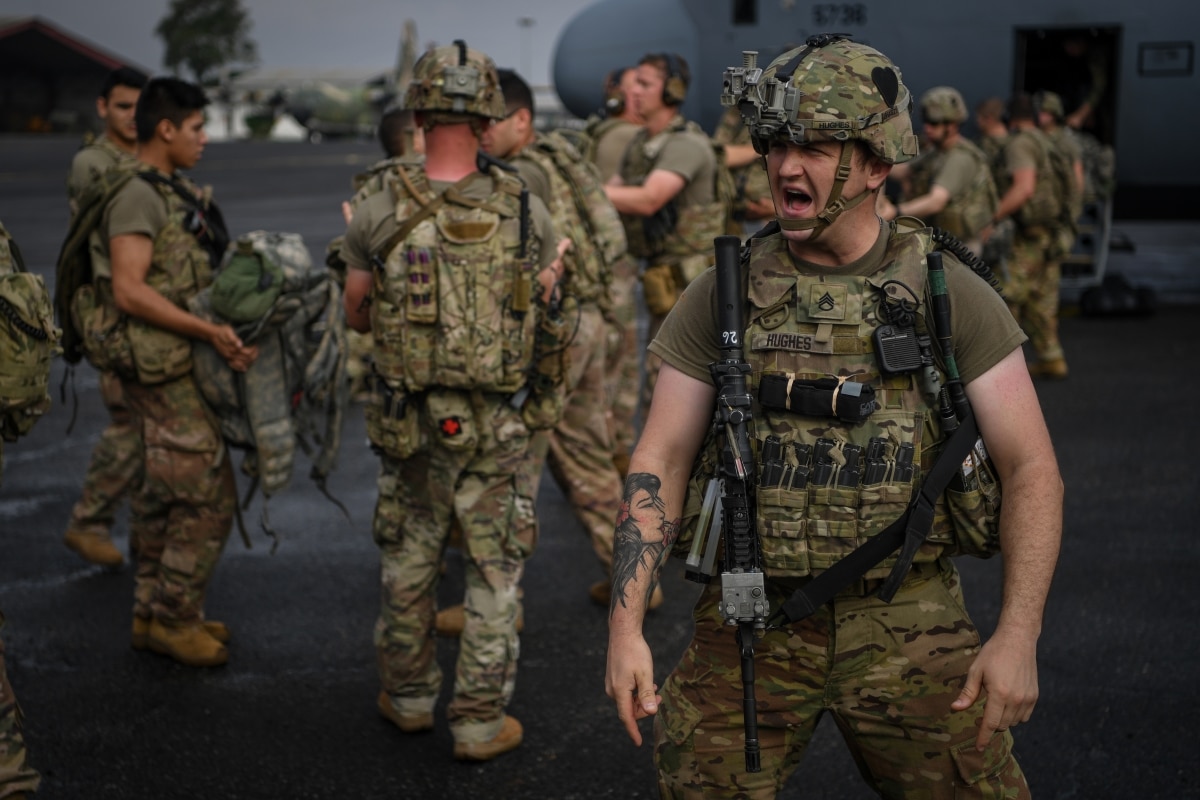 U.S. Army Staff Sgt. Jordan Hughes, assigned to the East Africa Response Force (EARF), deployed in support of Combined Joint Task Force-Horn of Africa, shouts instructions during a mission readiness drill in Libreville, Gabon