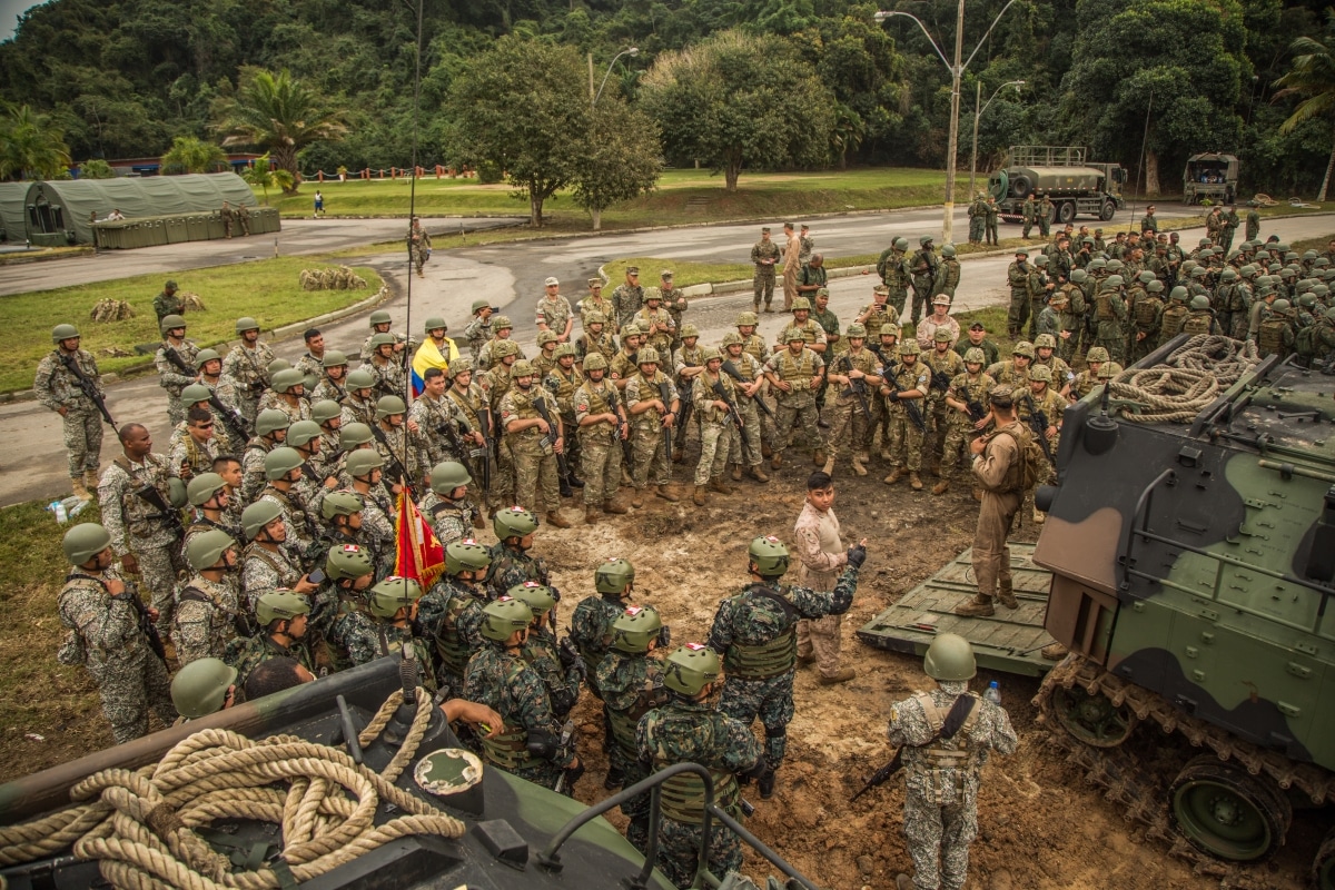 U.S. Marines with 4th Assault Amphibian Battalion, a unit based out of Tampa Bay, Florida, conduct a safety brief to Brazilian, Colombian, Peruvian, Chilean, Argentinian and Ecuadorian Marines before a ship-to-shore exercise during UNITAS LX on the Brazilian Marine Corps Base of Ilha do Governador