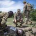 U.S. Army Staff Sgt. Elisha Waiters, instructor, 403rd Civil Affairs Battalion assigned to Combined Joint Task Force-Horn of Africa writes a team evaluation during a Counter Illicit Trafficking Junior Leadership Course examination at Queen Elizabeth Park, Uganda