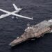 PACIFIC OCEAN (April 21, 2021) An MQ-9 Sea Guardian unmanned maritime surveillance aircraft system flies over Independence-variant littoral combat ship USS Coronado (LCS 4) during U.S.