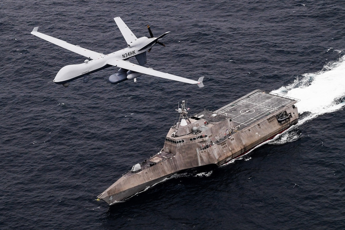 PACIFIC OCEAN (April 21, 2021) An MQ-9 Sea Guardian unmanned maritime surveillance aircraft system flies over Independence-variant littoral combat ship USS Coronado (LCS 4) during U.S.