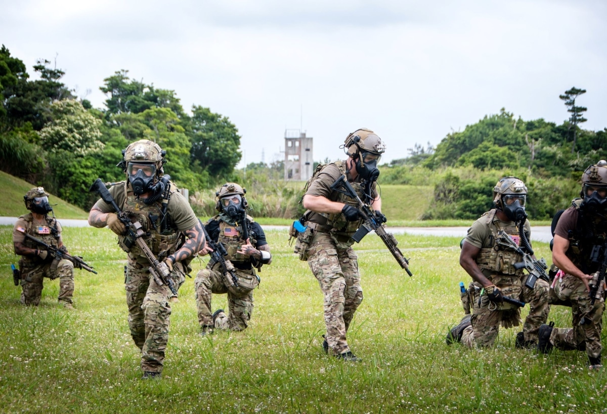 OKINAWA, Japan – Soldiers with 1st Battalion, 1st Special Forces Group (Airborne) and Explosive Ordinance Disposal Mobile Unit 5, begin a patrol towards an objective