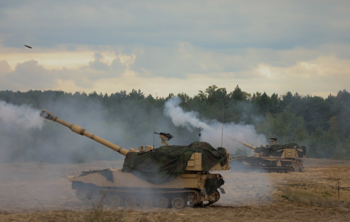 Soldiers with Alpha Battery, 1st Battalion, 5th Field Artillery Regiment (1-5), 1st Armored Brigade Combat Team (1ABCT), 1st Infantry Division (1ID) conduct Artillery Table XII with the M109 Paladin in Toruń