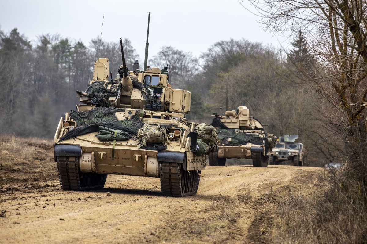 U.S. Soldiers assigned to 3rd Battalion, 66th Armored Regiment, 1st Brigade, 1st Infantry Division maneuver M2 Bradley Fighting Vehicles during exercise Allied Spirit 22 at the Joint Multinational Readiness Center in Hohenfels, Germany