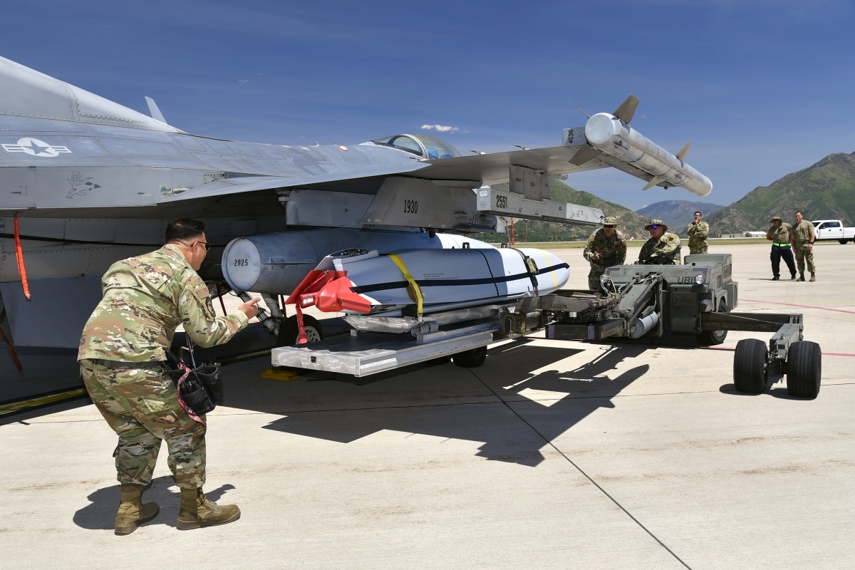 Airmen with the Air National Guard Air Force Reserve Command Test Center (AATC) load a Joint Air-to-Surface Standoff Missile (JASSM) on a pre-block F-16 for a test launch. This is the first time a JASSM has been launched from a pre-block F-16, a model flown by Air National Guard and Air Force Reserve units. (U.S. Air Force photo by Todd Cromar)