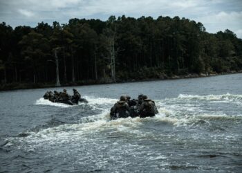 U.S. Marines with Headquarters and Service Company, 8th Engineer Support Battalion, Combat Logistics Regiment 27, ride a combat rubber reconnaissance craft during Summer Pioneer 2022 at Camp Lejeune, North Carolina