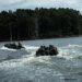 U.S. Marines with Headquarters and Service Company, 8th Engineer Support Battalion, Combat Logistics Regiment 27, ride a combat rubber reconnaissance craft during Summer Pioneer 2022 at Camp Lejeune, North Carolina