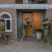 SAN DIEGO (Dec. 1, 2022) U.S. Navy and Republic of Korea Navy SEALs prepare to enter a building while conducting a fully integrated target assault scenario as part of military operations in urban terrain practice during a bilateral training exercise.