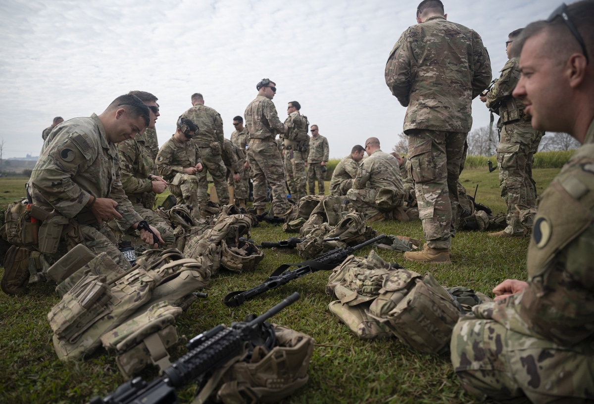 U.S. Army infantrymen assigned to the East African Response Force (EARF) load magazines in South Africa, July 21, 2022, for a range day in support of an expeditionary deployment readiness exercise.