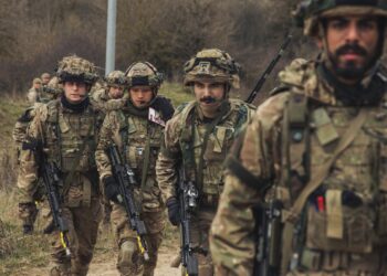 Cadets from the Royal Military Academy Sandhurst move a simulated casualty to an evacuation vehicle during during Dynamic Victory 23-1 at the Joint Multinational Readiness Center near Hohenfels, Germany, on March 20, 2023.