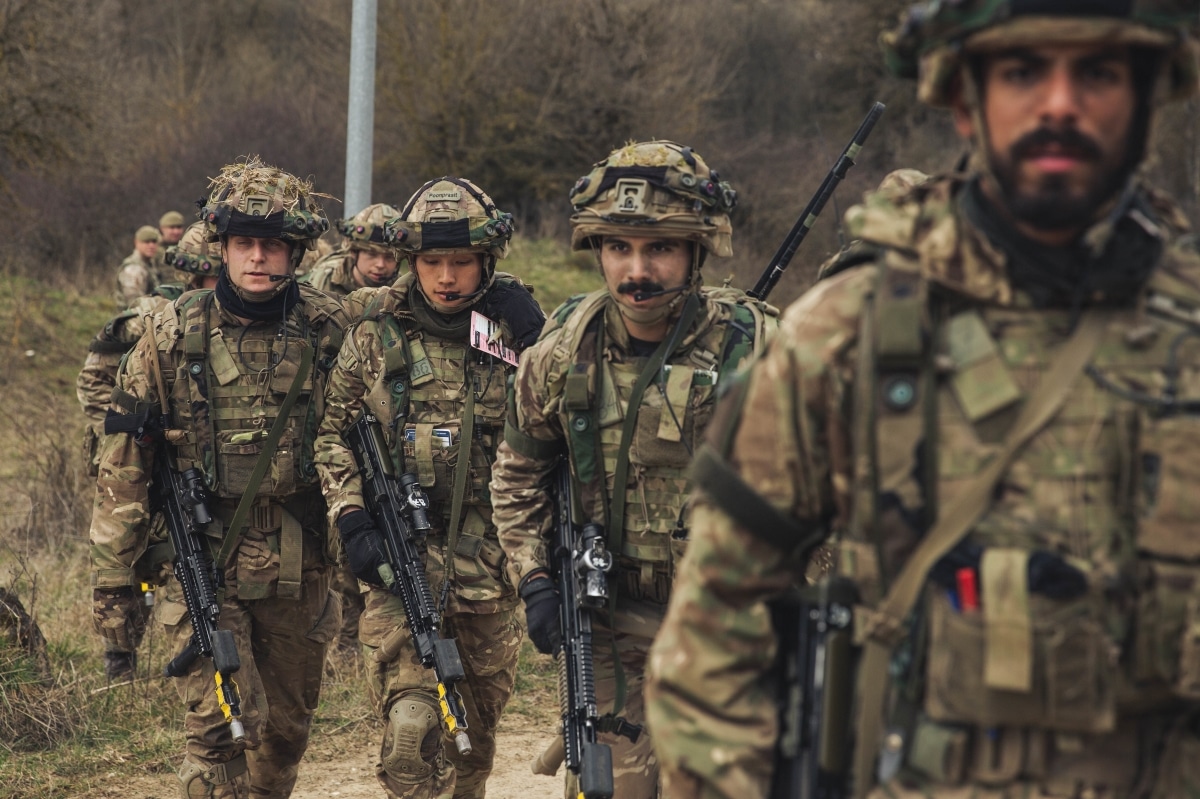 Cadets from the Royal Military Academy Sandhurst move a simulated casualty to an evacuation vehicle during during Dynamic Victory 23-1 at the Joint Multinational Readiness Center near Hohenfels, Germany, on March 20, 2023.