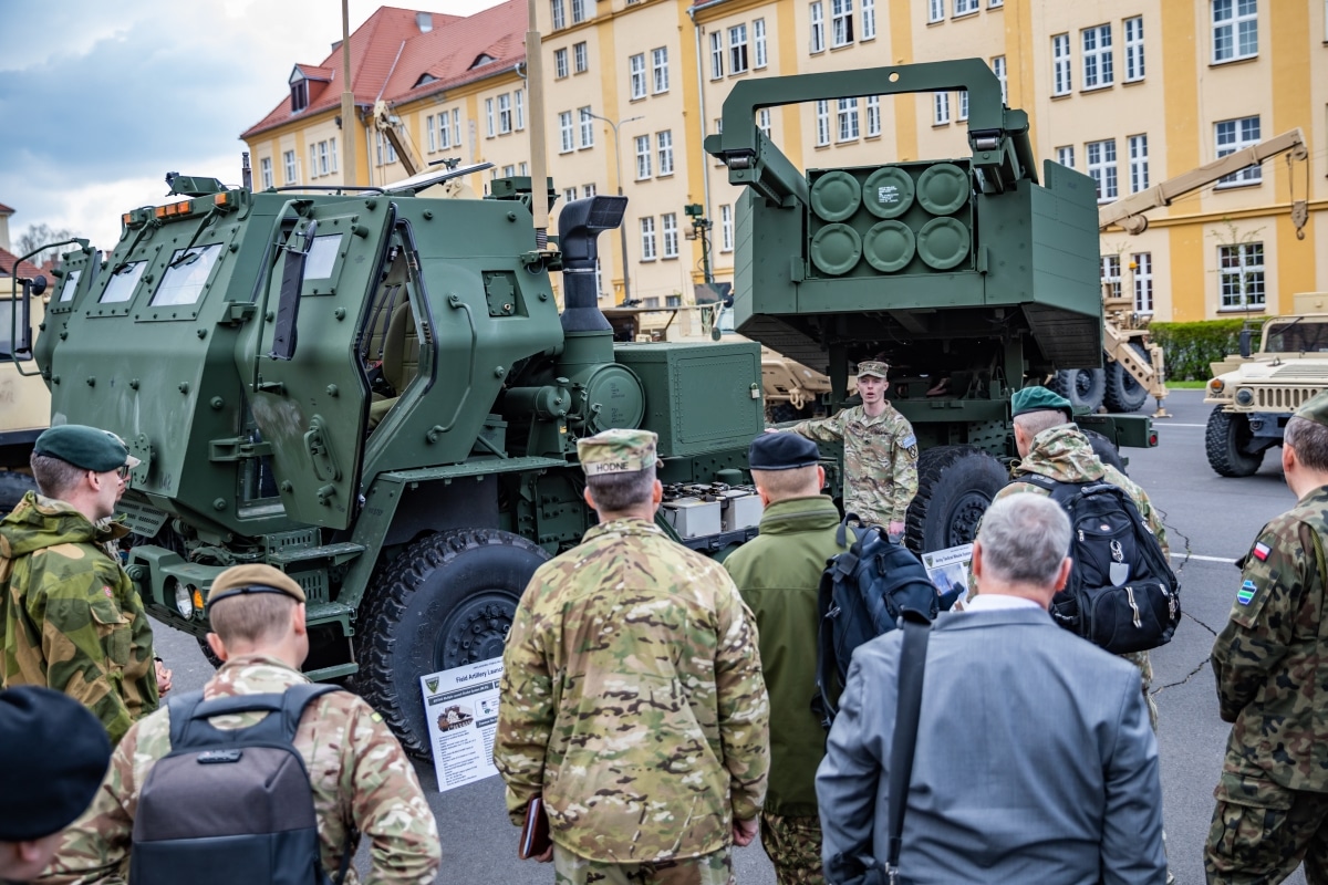 U.S. and NATO senior military leaders receive a tour of the M142 High Mobility Artillery Rocket System during the European Rocket Artillery Summit in Toruń, Poland, April 18, 2023.