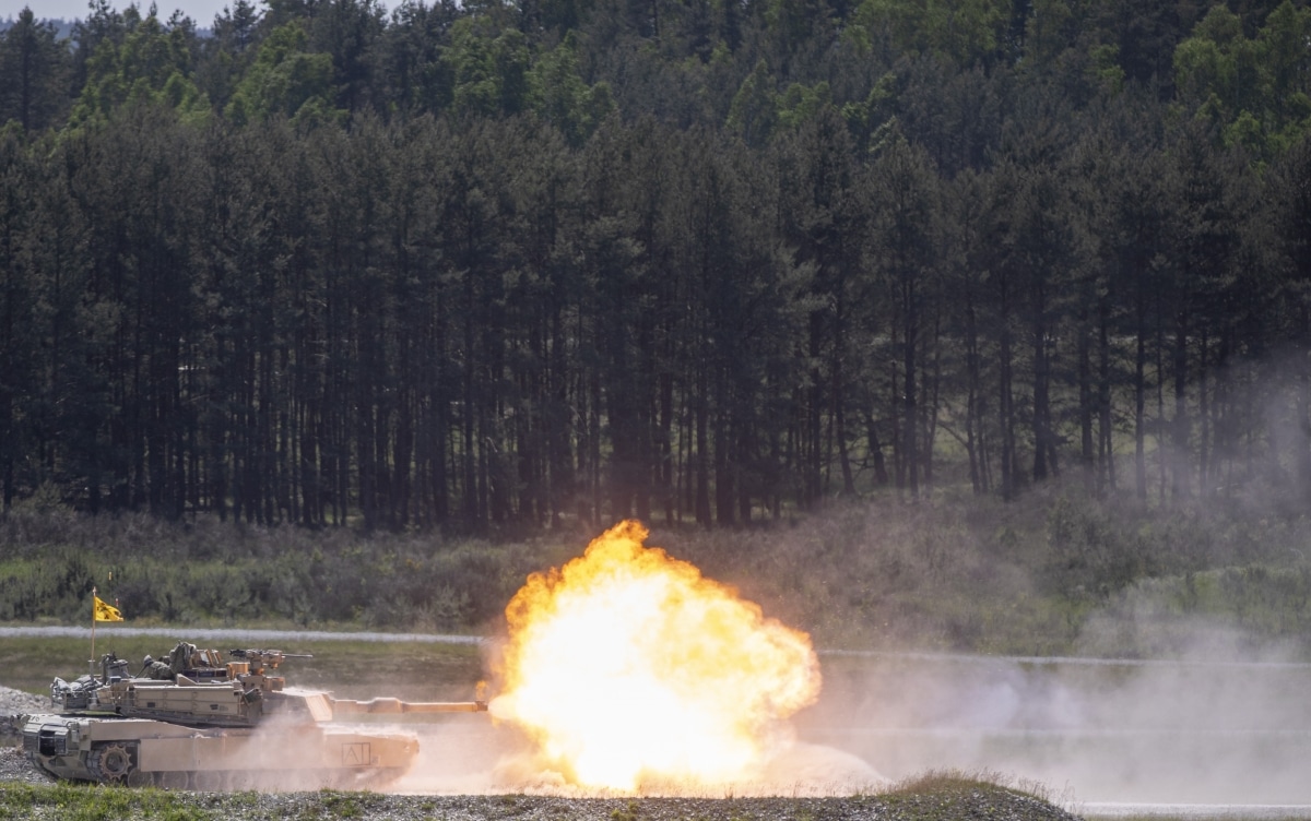 An M1A2 Abrams tank from 1st Battalion, 63rd Armor Regiment fires a round during training at Grafenwoehr, Germany, May 25, 2023.