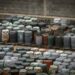 Photo of a Chemical waste dump with a lot of barrels