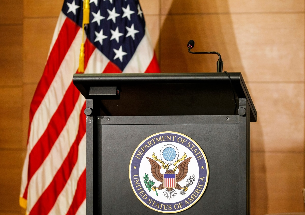 a tribune for official statement with sign of department of state united states of America , a microphone and a the US flag during an event in kiev, Ukraine, 27 July 2019