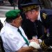 TOULOUSE, FRANCE - JULY 14: a senior officer talking with a green beret retired during the French paratroopers and police forces parade during the celebration of the 14 of july, bastille day