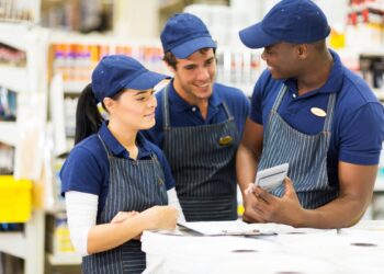 group of hardware store workers discussing work