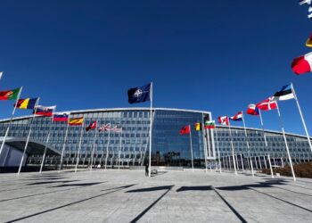 The national flags of countries member of the NATO fly outside the organisation headquarters in Brussels, Belgium on April 3, 2023.
