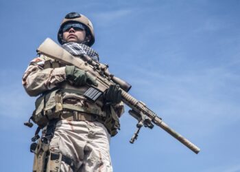 Member of Navy SEAL Team with weapons in action