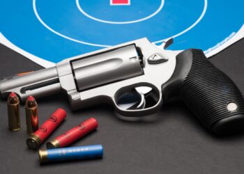 Las Vegas, NV, USA - January 25, 2016: Closeup of Taurus Judge 4510 revolver with .410 guage and .45 long Colt ammunition.