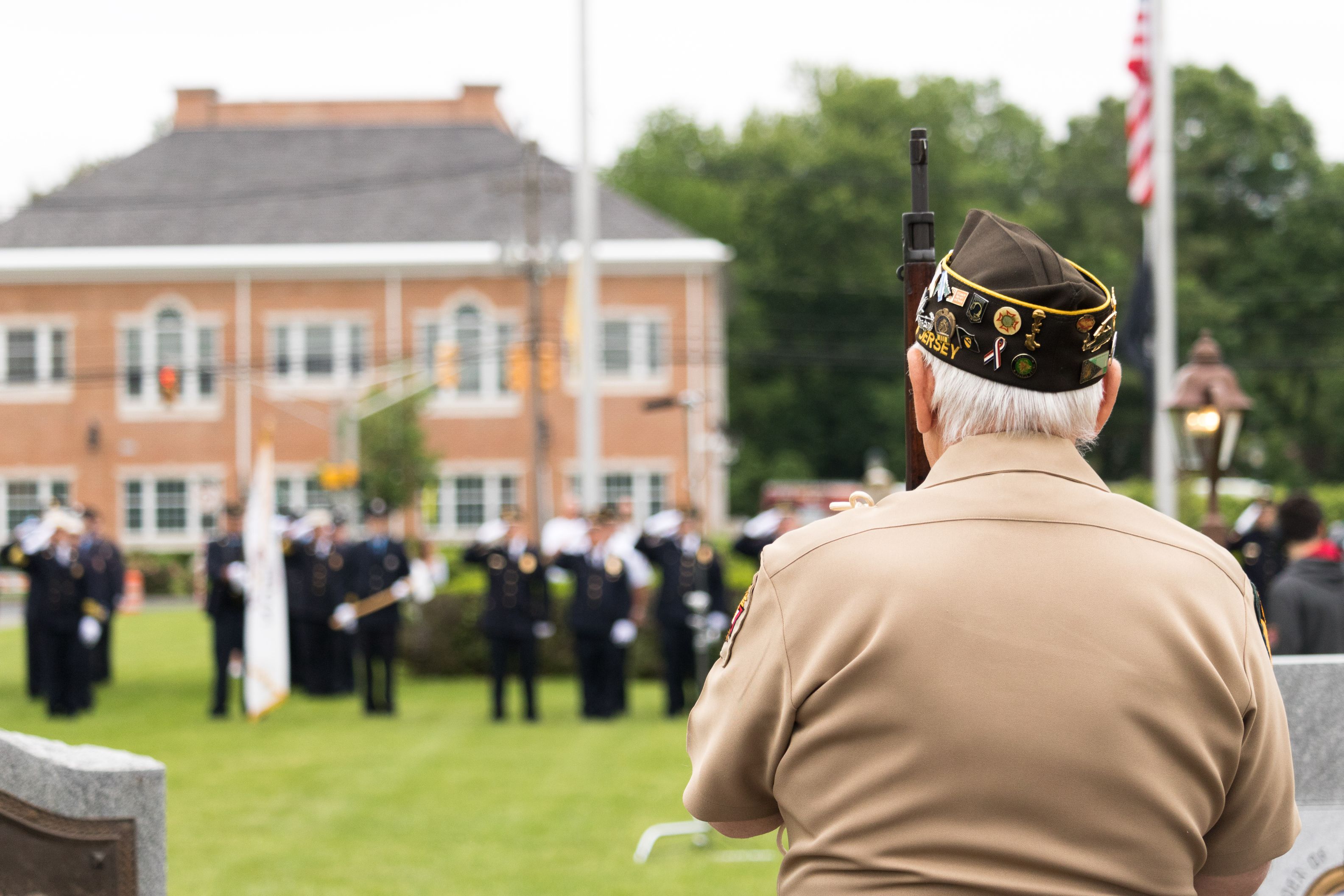 Livingston, NJ / United States - May 28 2018: A veteran pays his respect during a memorial service on Memorial Day.