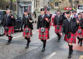 EDINBURGH, SCOTLAND - MAY 20: Ceremonial march of orchestra with bagpipes and kilts on May 20, 2018 in Edinburgh