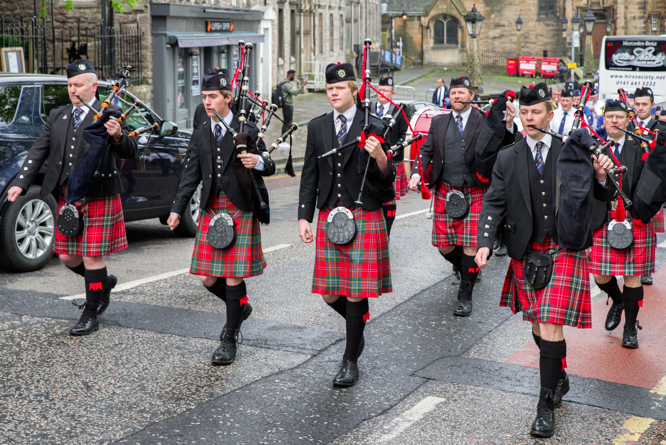 EDINBURGH, SCOTLAND - MAY 20: Ceremonial march of orchestra with bagpipes and kilts on May 20, 2018 in Edinburgh