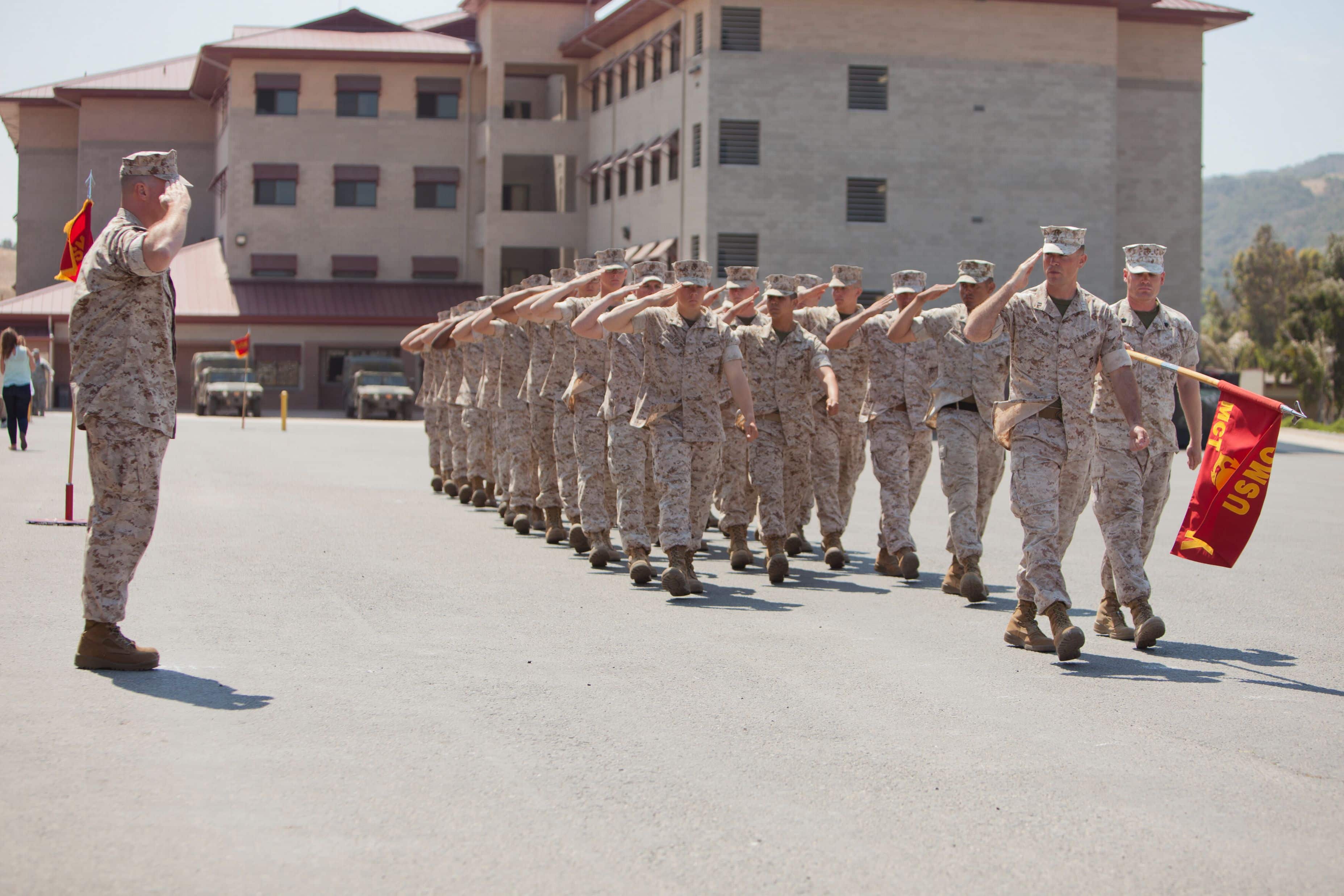 U.S. Marine Corps Lt. Col. William B. Allen IV, Commanding Officer, Marine Combat Training Battalion, School of Infantry-West, salutes during the Pass in Review during a Change of Command Ceremony at Camp Pendleton