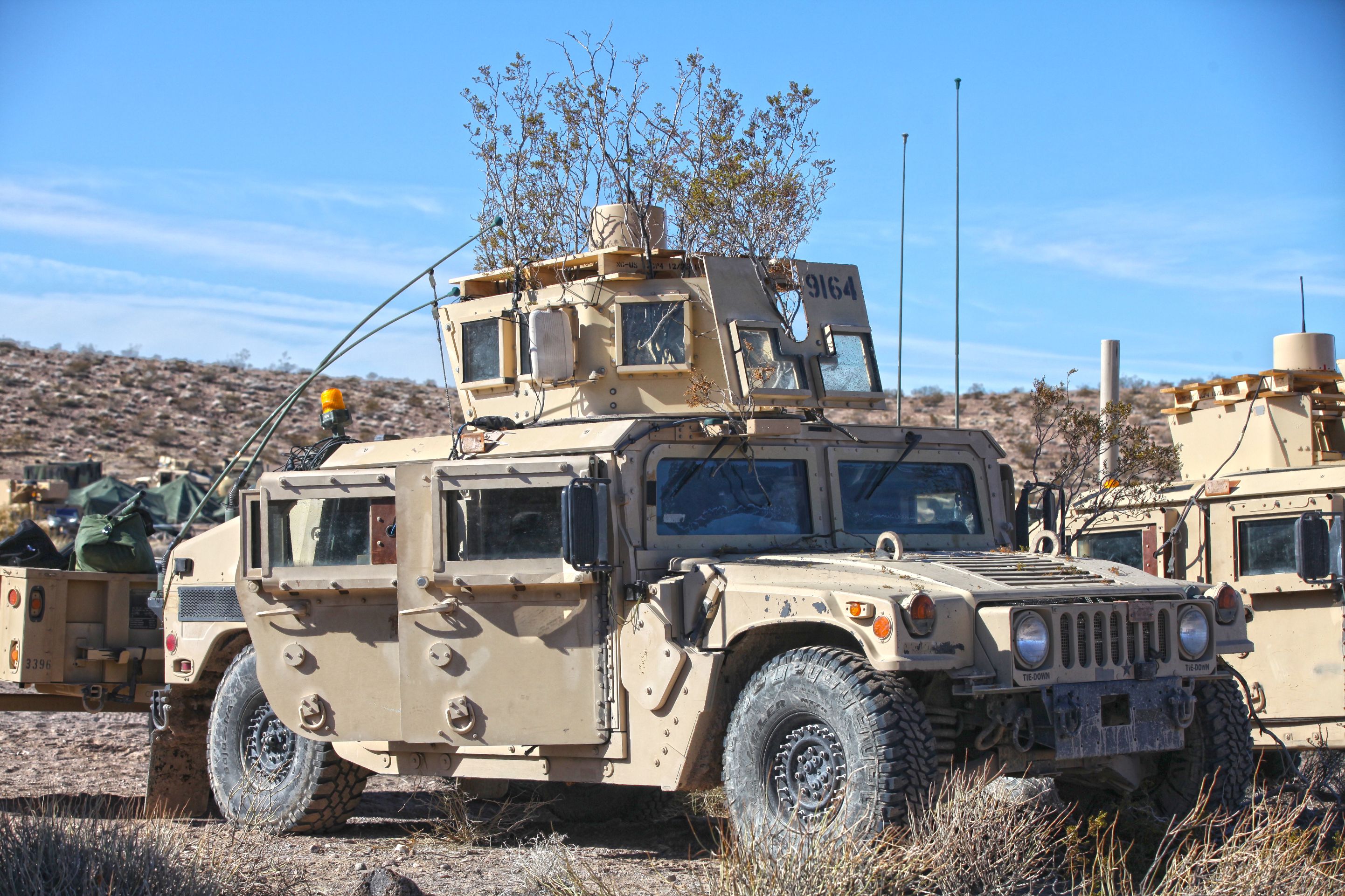 A High Mobilility Multi-Wheeled Vehicle camouflaged by the Electronic Warfare Group from 1st Stryker Brigade Combat Team, 25th Infantry Division at the National Training Center, Ft. Irwin