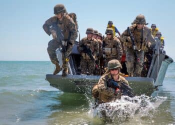 U.S. Marines with 3rd Battalion, 23rd Marine Regiment, assault a beach using a Turkish Higgins landing boat from the Turkish ship TCG Karamurselbey