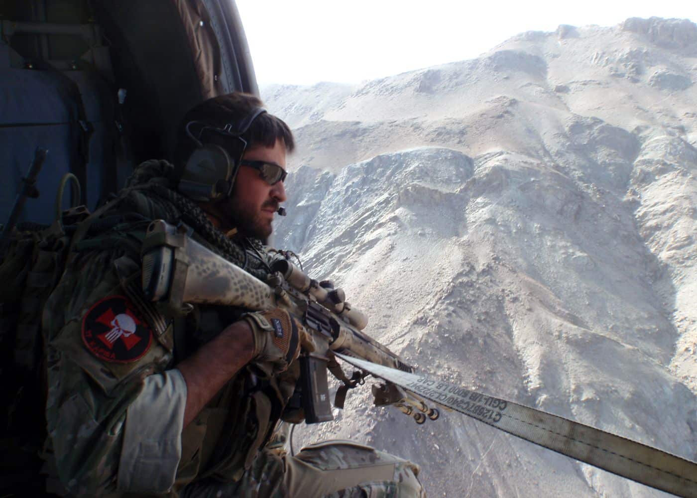 Tech. Sgt. Ted Hofknecht watches for insurgent activity from the side door of a helicopter in eastern Afghanistan. Hofknecht was honored at the Jewish Institute of National Security Affairs awards dinner
