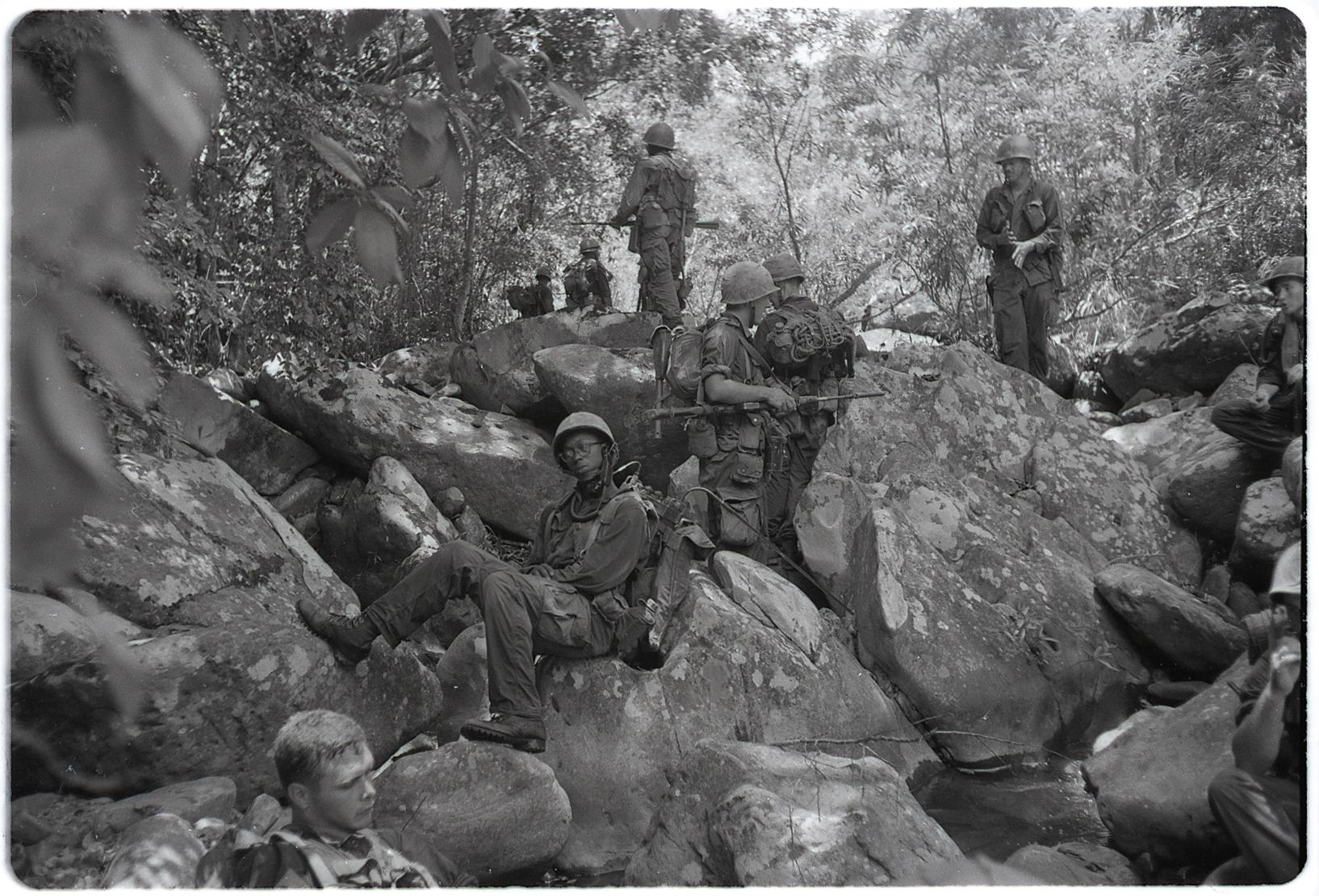 Marines of Company L, 3rd Battalion, 5th Marines, take a rest on rocky terrain near Dong Ha during Operation Hastings in Vietnam, July 1966. Marine Corps photo by Staff Sgt. R.E. Wilson
