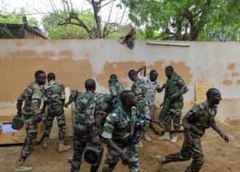 Nigerien soldiers from the Nigerien Mortar Team participates in large deflection and elevation changes class at Tondibiah, Niger, May 5, 2021. Soldiers need to know all mechanical actions of the 60mmm mortar system to effectively employ the system. (U.S. Army National Guard photo by Sgt. Brandon Julson)